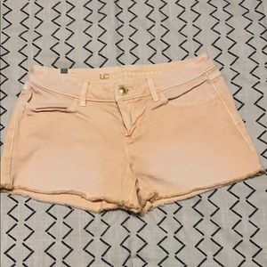 Distressed peach denim shorts